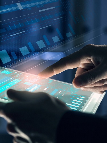 A person is analyzing a graph displayed on a tablet screen.